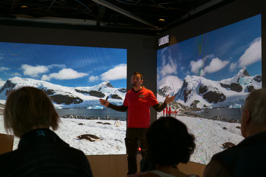 Briefing visitors to Antarctica on the IAATO guidelines for the fragile polar ecosystem. Photo / Thomas Bywater 